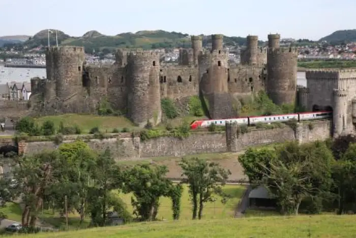 Virgin Train passing Conwy Castle on route to London