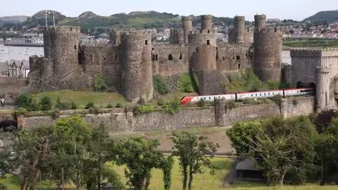 Virgin Train passing Conwy Castle on route to London